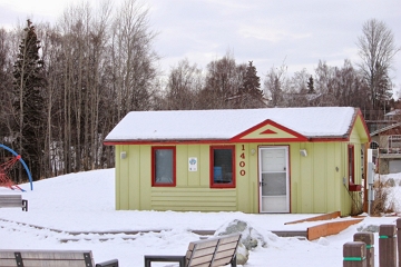 Casa no Alasca Casa no Alasca com telhado coberto por neve