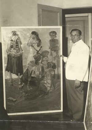 Cândido Portinari Foto de Portinari ao lado deu uma de suas pinturas