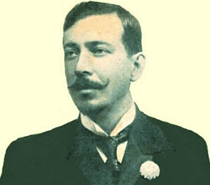 Foto em preto e branco de Joaquim Osório Duque Estrada, homem branco de meia idade com cabelo curto escuro e bigode com pontas