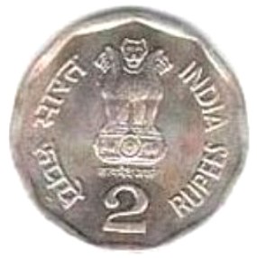 Foto de uma moeda de cor prateada com o número 2 estampado e um desenho de um animal parecido com leão